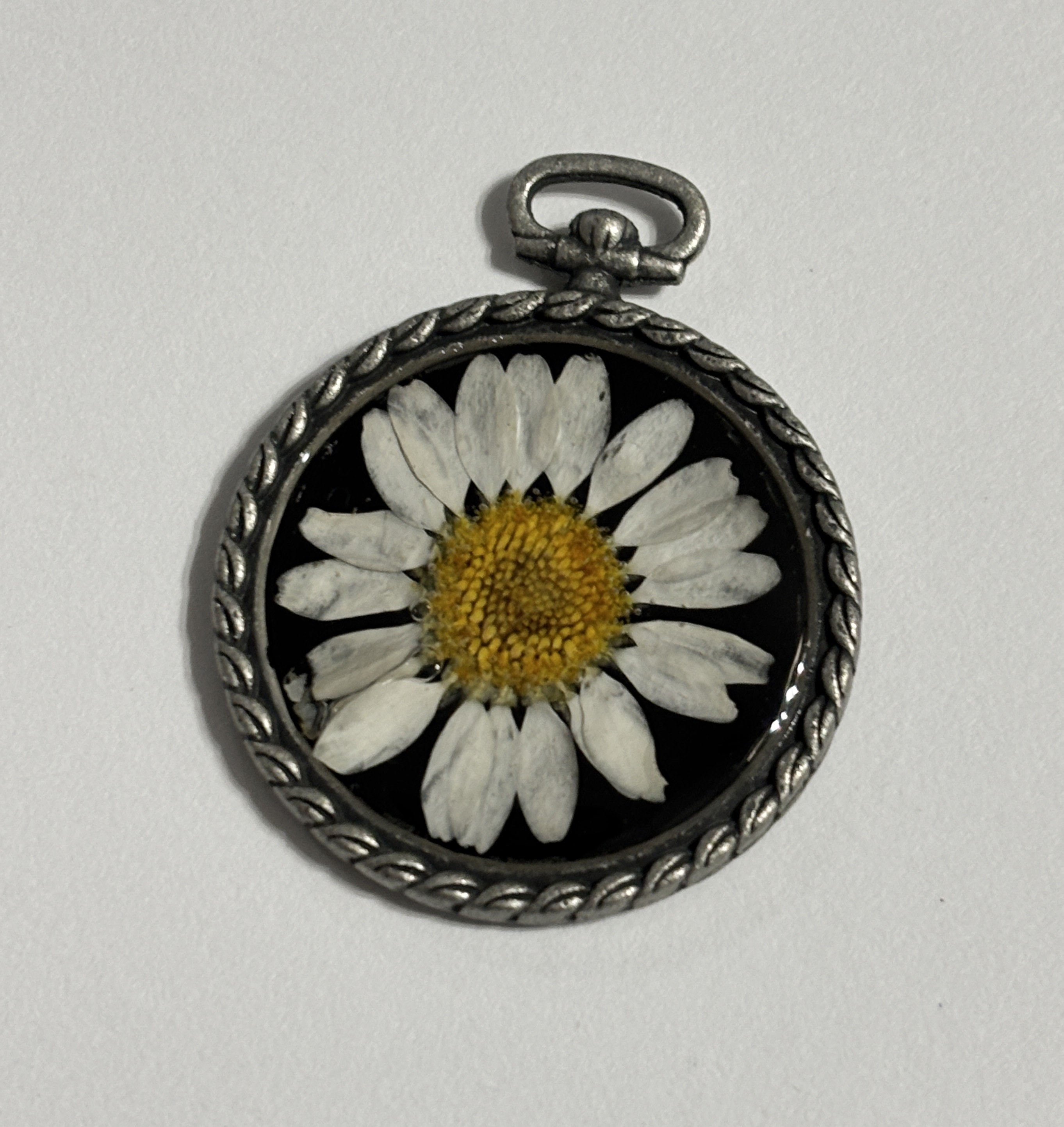 Pressed daisy flower pendant in a vintage silver frame