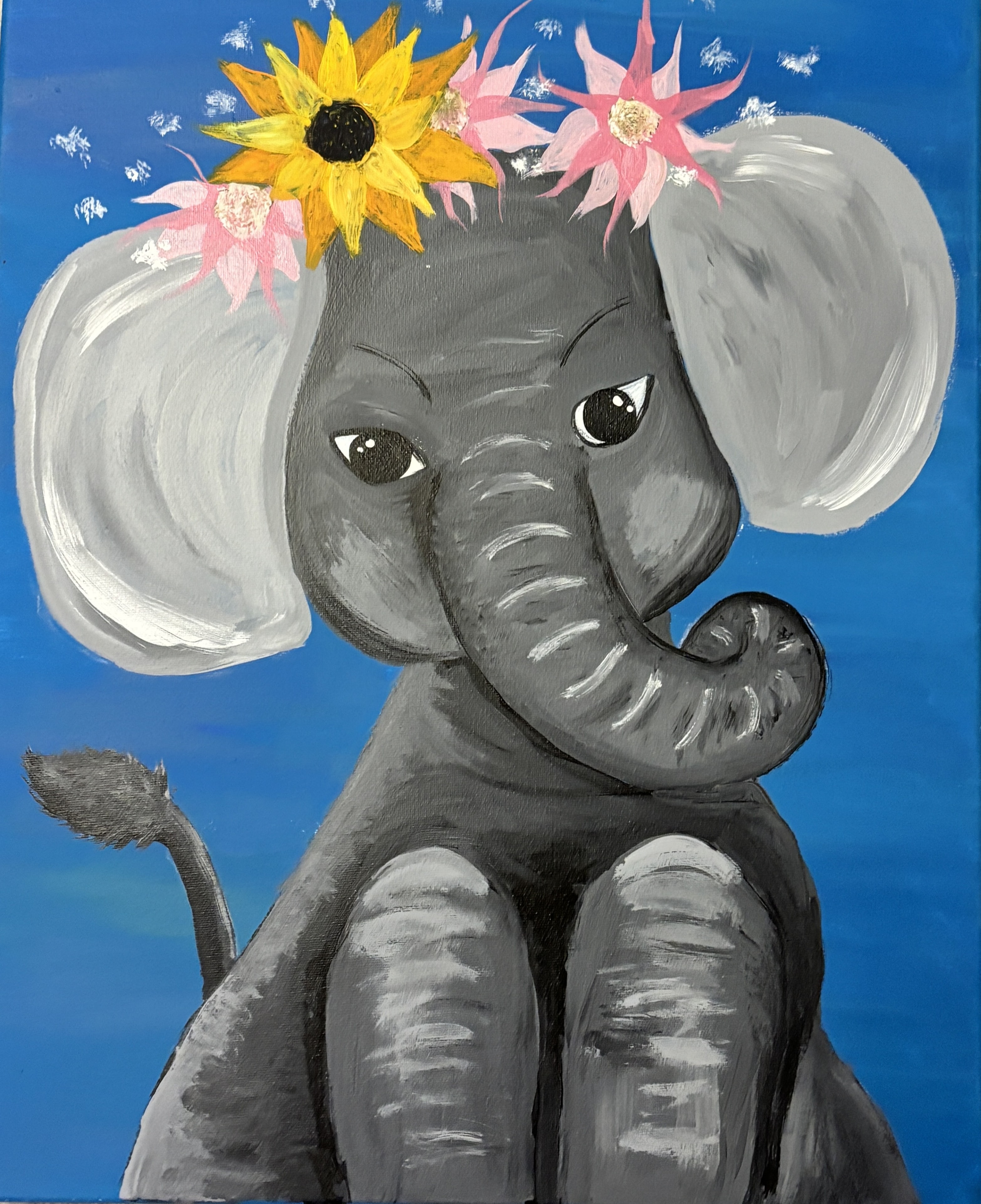 Painted elephant with flower crown on blue background