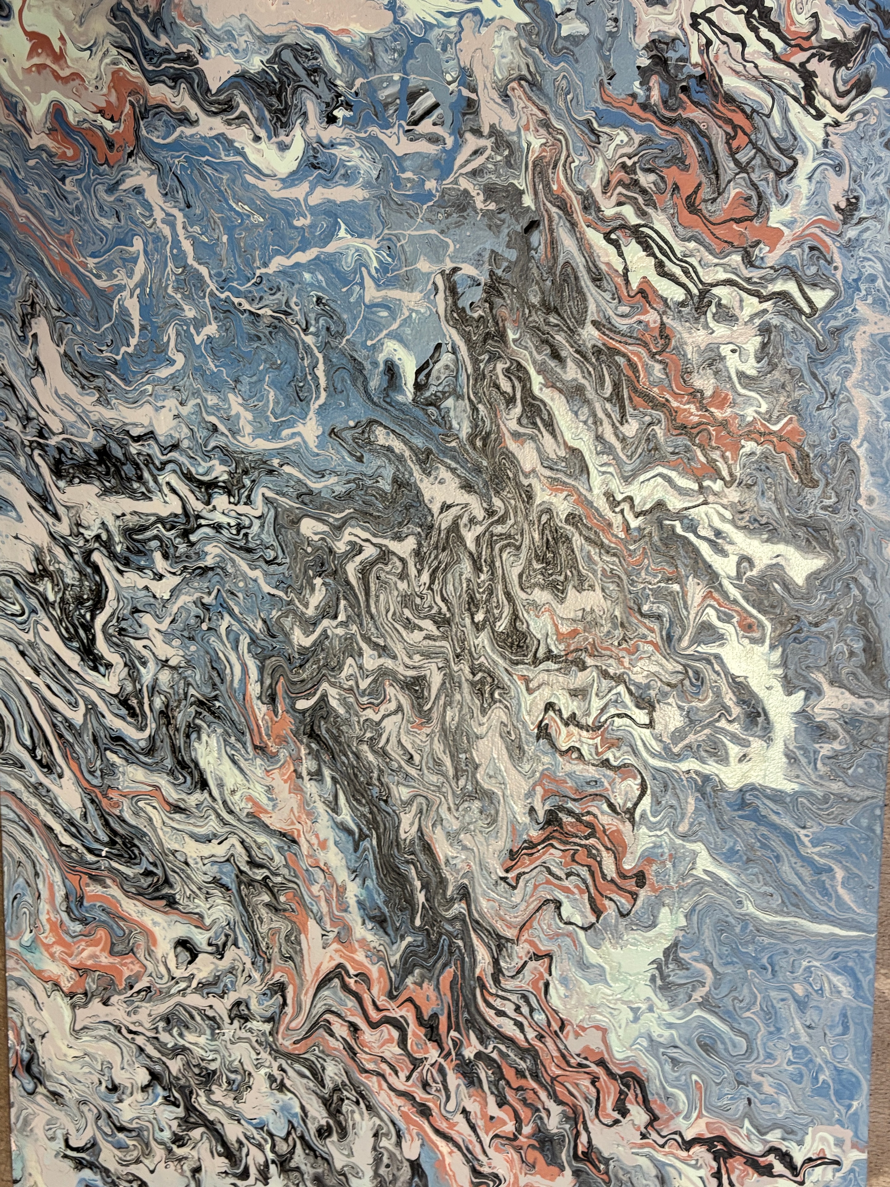 Abstract marbled fluid art in blue, terracotta, and white